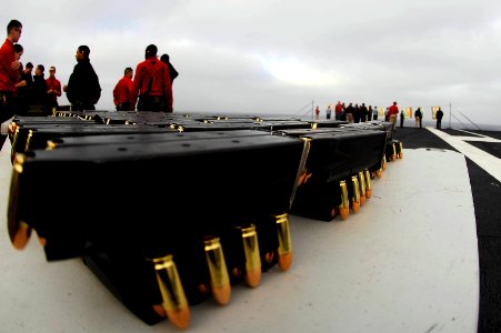 US Navy 081009-N-9928E-005 Sailors assigned to the security division of the operations department aboard the Nimitz-class aircraft carrier USS John C. Stennis (CVN 74) participate in small arms qualifications