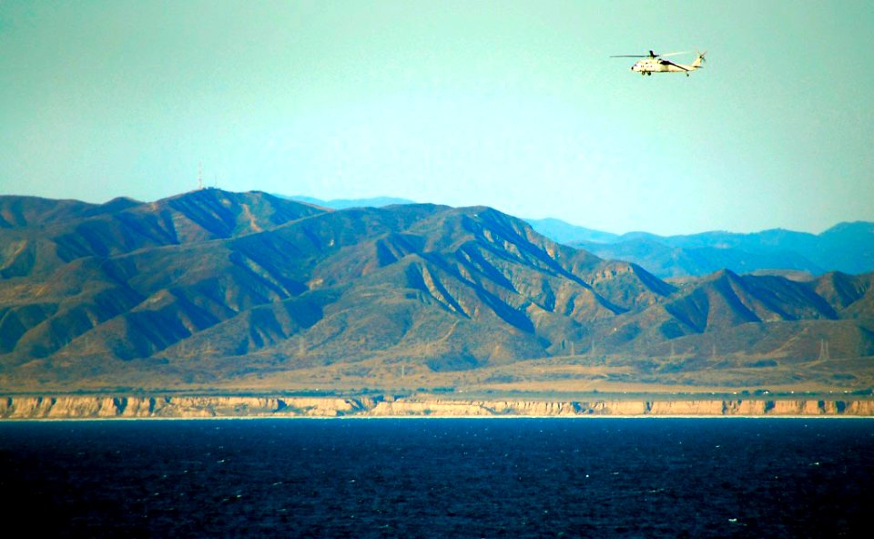 US Navy 081011-N-4774B-191 An SH-60S Sea Hawk helicopter flies along the Southern California coastline