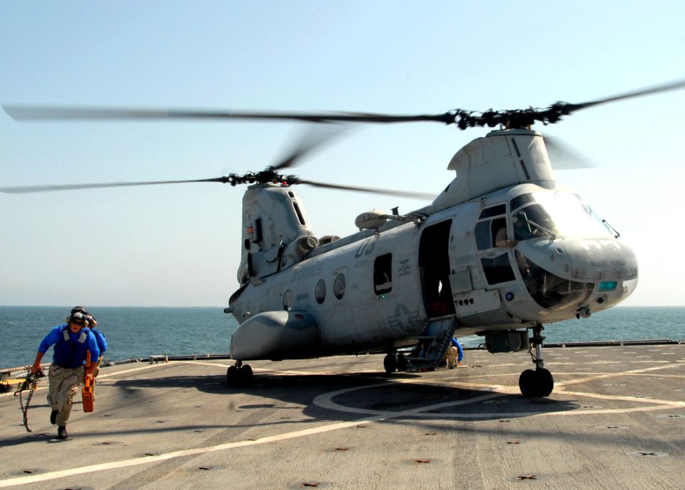 US Navy 081008-N-9134V-048 Sailors remove chocks and chains from a CH-46E Sea Knight helicopter assigned to Marine Medium Helicopter Squadron (HMM) 264 aboard the amphibious dock landing ship USS Carter Hall (LSD 50)