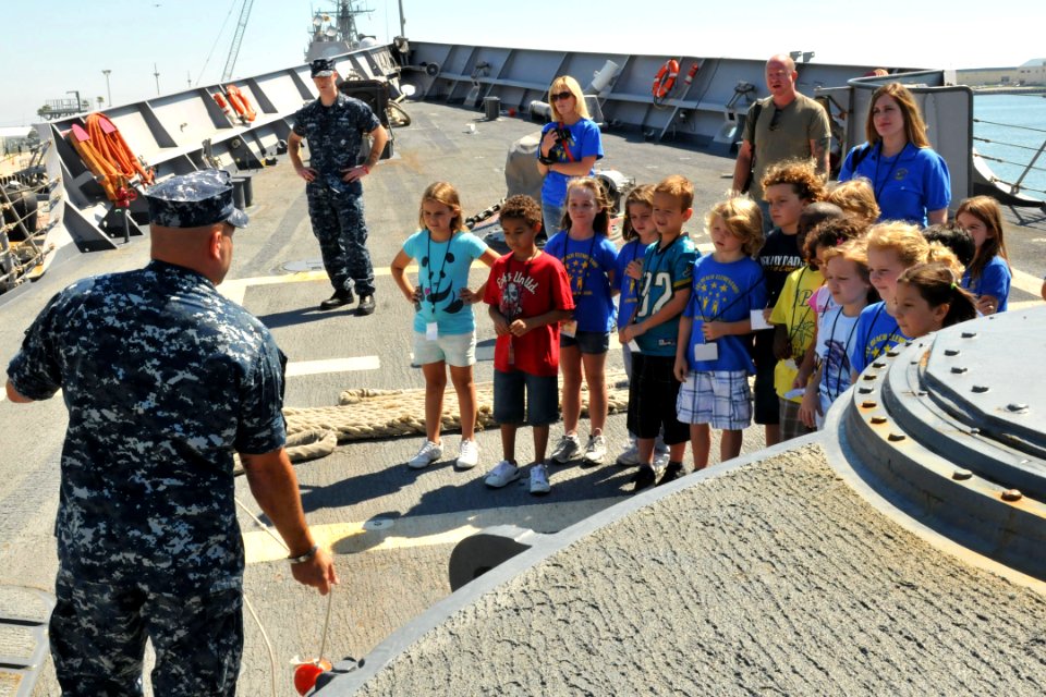 US Navy 101004-N-5812W-002 Sailors aboard the guided-missile frigate USS Simpson (FFG 56) explain about mooring lines and the ship's anchor to 2nd