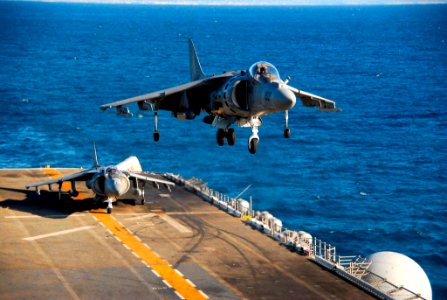 US Navy 081011-N-4774B-196 An AV-8B Harrier II jet 214 lands aboard the flight deck of USS Boxer (LHD 4)