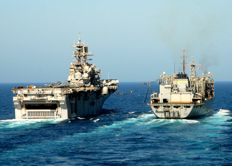 US Navy 081009-N-9134V-057 The multi-purpose amphibious assault ship USS Iwo Jima (LHD 7) conducts a replenishment at sea with Military Sealift Command fleet combat support ship USNS Bridge (T-AOE 10)