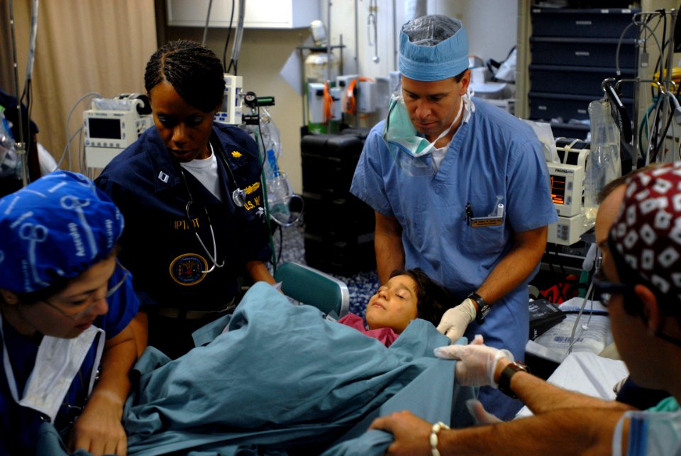 US Navy 081010-N-3595W-849 Joint military medical personnel tend to twin brothers after eye surgery
