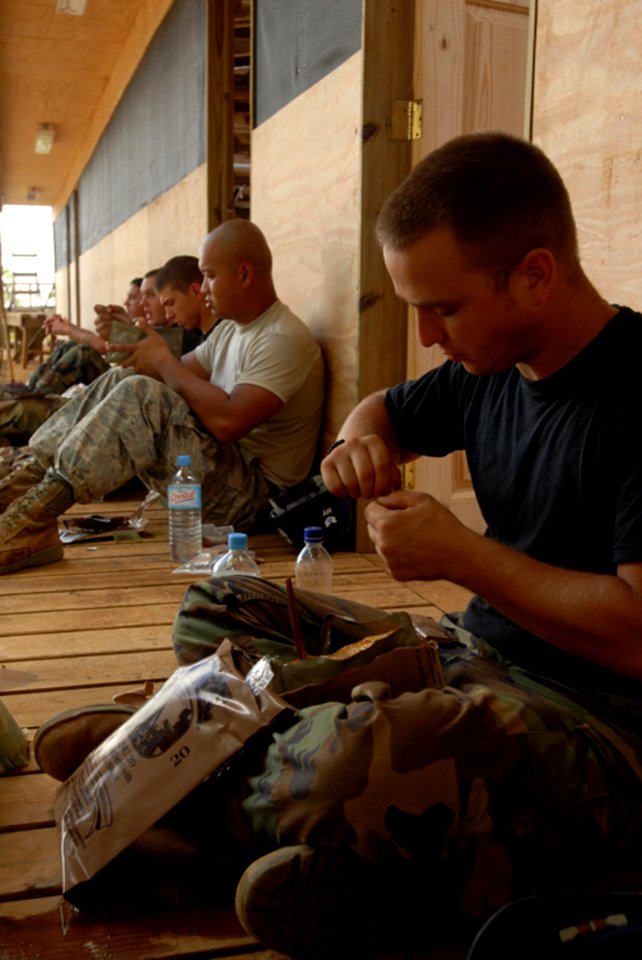 US Navy 081012-N-3595W-153 Air Force engineerstake a break for lunch during construction of four new classrooms