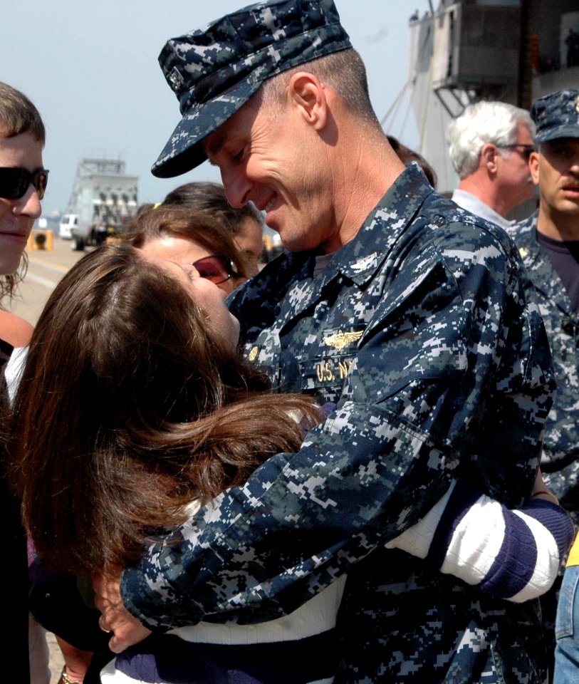 US Navy 100403-N-9806M-079 Capt. Steve Koehler greets family members following Bataan's return to Naval Station Norfolk