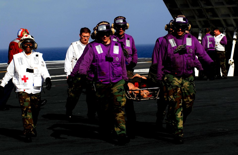 US Navy 081010-N-9928E-079 Sailors carry a simulated personnel casualty during flight deck drills aboard the Nimitz-class aircraft carrier USS John C. Stennis (CVN 74)