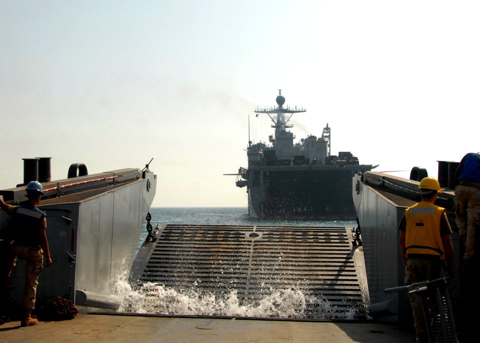 US Navy 081012-N-3392P-162 A landing craft utility (LCU) assigned to Assault Craft Unit (ACU) 4 approaches the amphibious dock landing ship USS Carter Hall (LSD 50). Carter Hall is deployed as part of the Iwo Jima Expeditionary