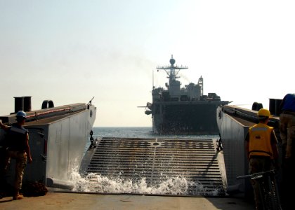 US Navy 081012-N-3392P-162 A landing craft utility (LCU) assigned to Assault Craft Unit (ACU) 4 approaches the amphibious dock landing ship USS Carter Hall (LSD 50). Carter Hall is deployed as part of the Iwo Jima Expeditionary photo