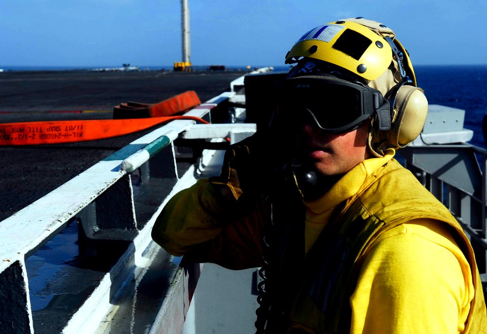 US Navy 081010-N-9928E-098 Aviation Boatswain's Mate (Handling) 3rd Class Howard Mozer uses sound powered phones