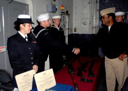 US Navy 081011-N-6439C-121 Vice Adm. Mel Williams Jr., commander of the U.S. 2nd Fleet, speaks with an amphibious assault ship USS Nassau (LHA 4) Sailor while visiting the ship in New York