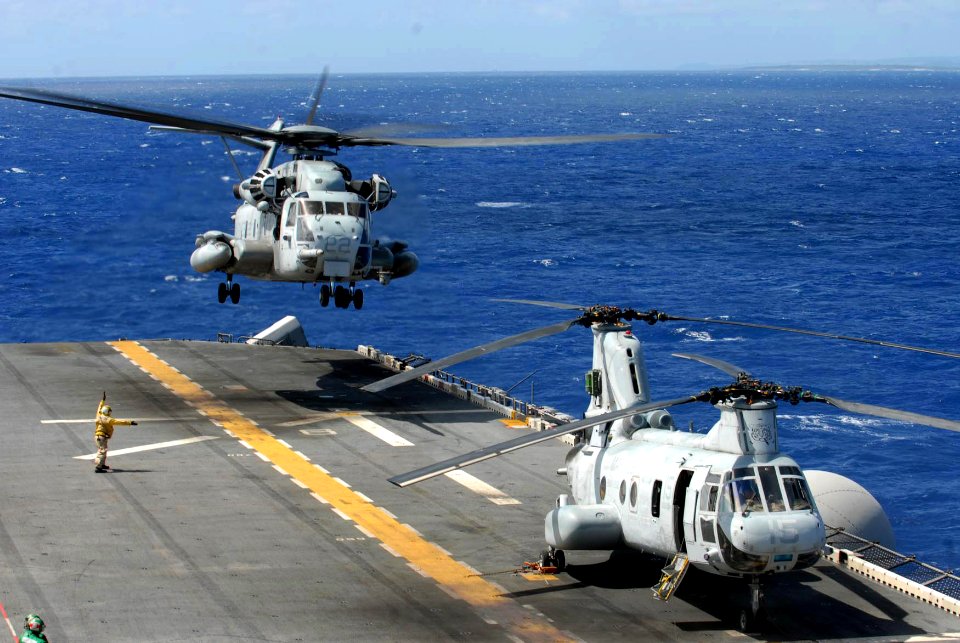 US Navy 081008-N-9950J-031 Aviation Boatswain's Mate (Handling) Airman Mario Teasley, from Charlotte, N.C., directs the take off of a CH-53E Sea Stallion helicopter aboard the forward-deployed amphibious assault ship USS Essex