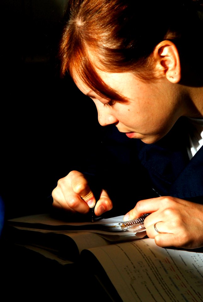US Navy 081009-N-2610F-018 Seaman Erin Koecke, from Tacoma, Wash., takes notes during an intermediate college algebra course aboard the Nimitz-class aircraft carried USS John C. Stennis (CVN 74)