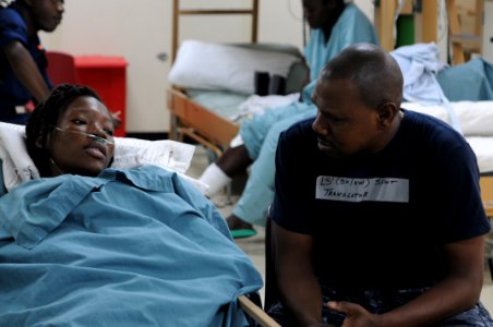 US Navy 100213-N-4995K-070 A Navy translator speaks with a Haitian patient
