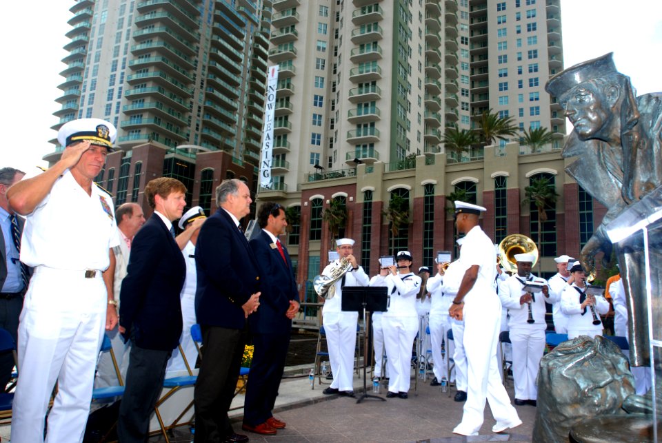 US Navy 081013-N-0486G-006 Guests stand as the Navy Band Southeast plays the Armed Forces Medley
