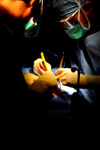 US Navy 081012-N-4515N-363 Eliecer Cruz Alvarez performs a hernia operation alongside Dr. Ricardo Guimaraes