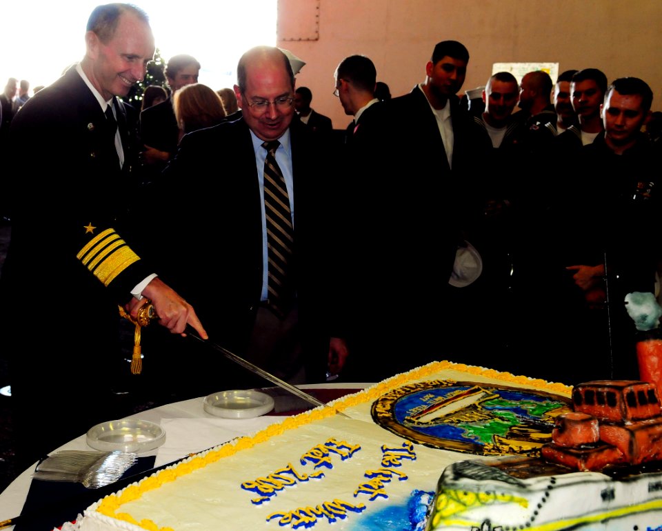 US Navy 081012-N-5758H-403 Secretary of the Navy (SECNAV) the Honorable Donald C. Winter and Adm. Jonathan W. Greenert cut a cake during a commemoration ceremony celebrating the 100th anniversary of the Great White Fleet