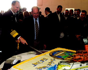 US Navy 081012-N-5758H-403 Secretary of the Navy (SECNAV) the Honorable Donald C. Winter and Adm. Jonathan W. Greenert cut a cake during a commemoration ceremony celebrating the 100th anniversary of the Great White Fleet photo