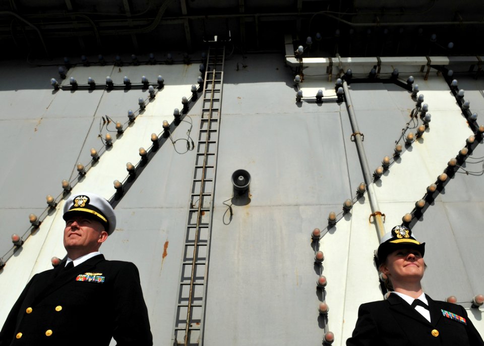 US Navy 081012-N-7981E-004 Sailors man the rails as the aircraft carrier USS Abraham Lincoln (CVN 72) arrives in its homeport of Everett Wash photo