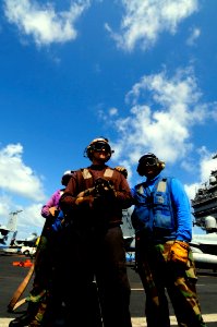 US Navy 081012-N-7918H-118 Flight deck personnel participate in a mass casualty drill aboard the Nimitz-class aircraft carrier USS Theodore Roosevelt (CVN 71)