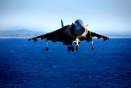 US Navy 081011-N-4774B-195 An AV-8B Harrier II jet begins a vertical descent