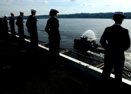 US Navy 081012-N-9898L-015 Sailors man the rails as the aircraft carrier USS Abraham Lincoln (CVN 72) returns to its homeport of Everett
