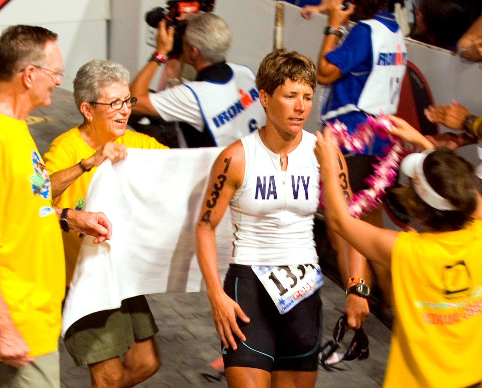 US Navy 081011-N-6674H-006 Cmdr. Kristin Barnes, officer-in-charge of Afloat Planning System, Pacific, is welcomed with Hawaiian leis as she crosses the finish line at the 30th Ford Ironman World Championship
