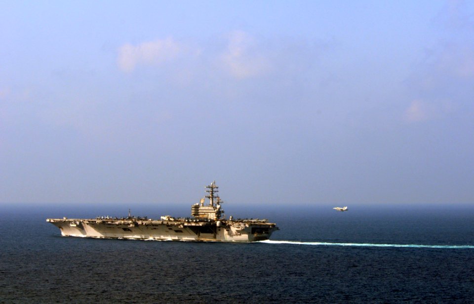 US Navy 081013-N-3659B-331 An F-A-18 Hornet makes its final approach to the flight deck prior to making an arrested landing on the Nimitz-class aircraft carrier USS Ronald Reagan (CVN 76)