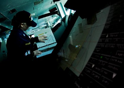 US Navy 081011-N-9928E-022 Lt. Lena Whitehead, from Camarillo, Calif., makes a radio logbook entry while standing junior officer of the watch on the bridge of the Nimitz-class aircraft carrier USS John C. Stennis (CVN 74)