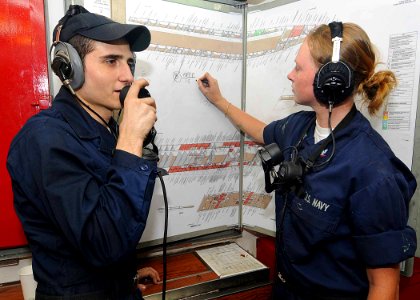 US Navy 100514-N-1082Z-066 Sailors mark damage control points on the ship's layout during a damage control drill