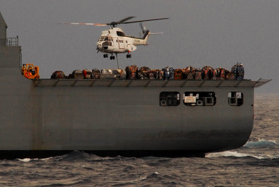 US Navy 100129-N-3327M-049 A helicopter from military sealift command conducts and underway replenishment