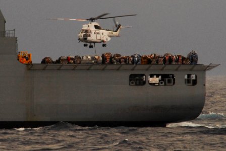 US Navy 100129-N-3327M-049 A helicopter from military sealift command conducts and underway replenishment
