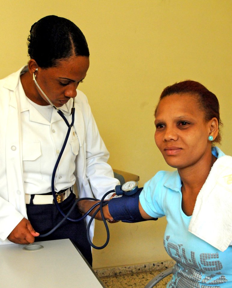 US Navy 081016-N-5642P-054 A Dominican Republic Navy doctor takes the blood pressure of a patient at the 27 Febrero medical site during the humanitarian assistance mission Continuing Promise 2008