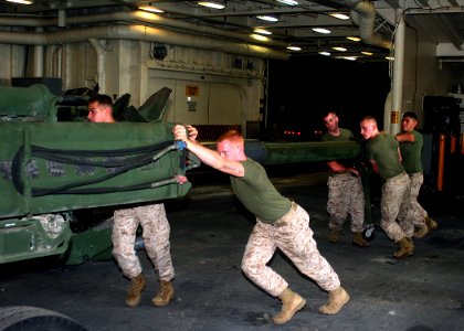 US Navy 081012-N-6764G-119 Marines assigned to the 26th Marine Expeditionary Unit (MEU) work aboard the amphibious transport dock ship USS San Antonio (LPD 17)