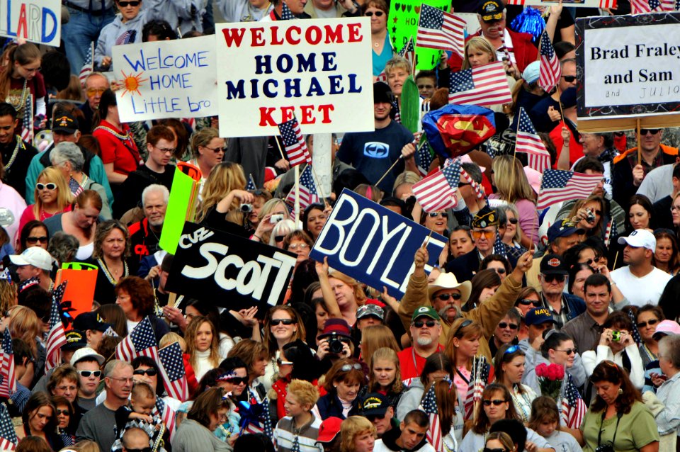 US Navy 081012-N-7981E-270 Friends and family greet Sailors aboard the aircraft carrier USS Abraham Lincoln (CVN 72) as the ship arrives in its homeport of Everett Wash