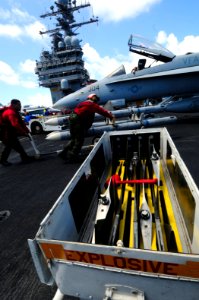 US Navy 081014-N-7918H-142 Aviation Ordnancemen attach missiles to an aircraft