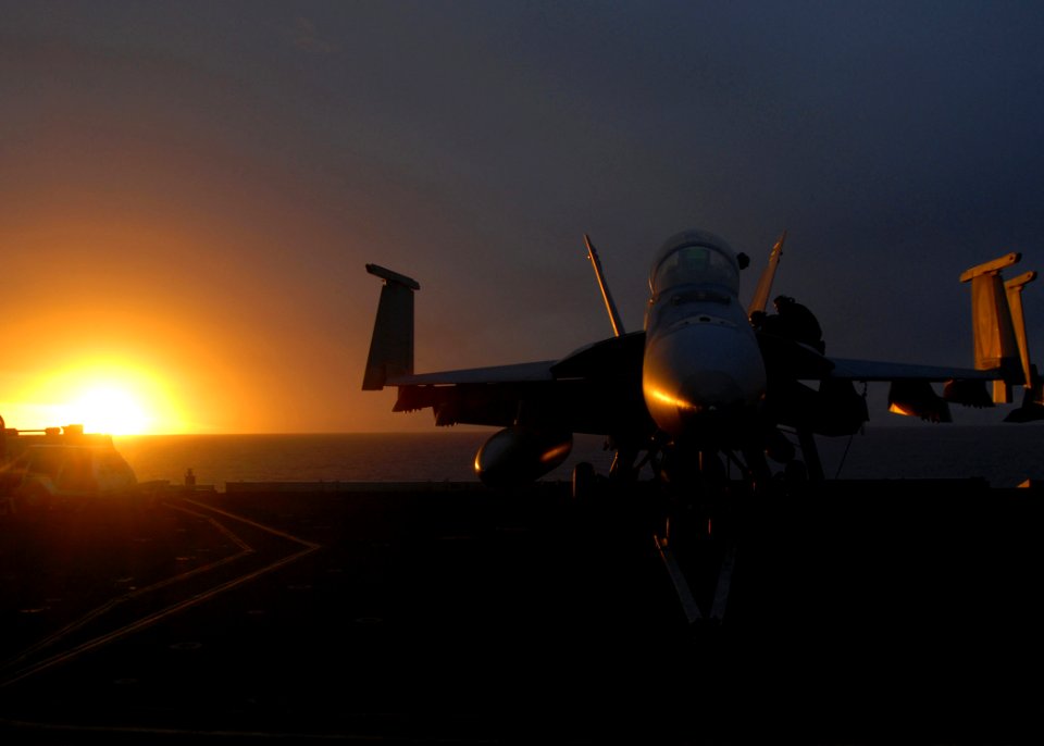 US Navy 081017-N-1644H-243 An F-A-18 Hornet its on the flight deck of the Nimitz-class aircraft carrier USS George Washington (CVN 73) at dusk