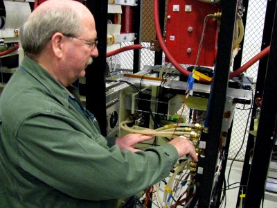 US Navy 091203-N-6607H-001 Don Henderson checks connections for the Ship's System Power Services Test Facility at Naval Sea Systems Comman