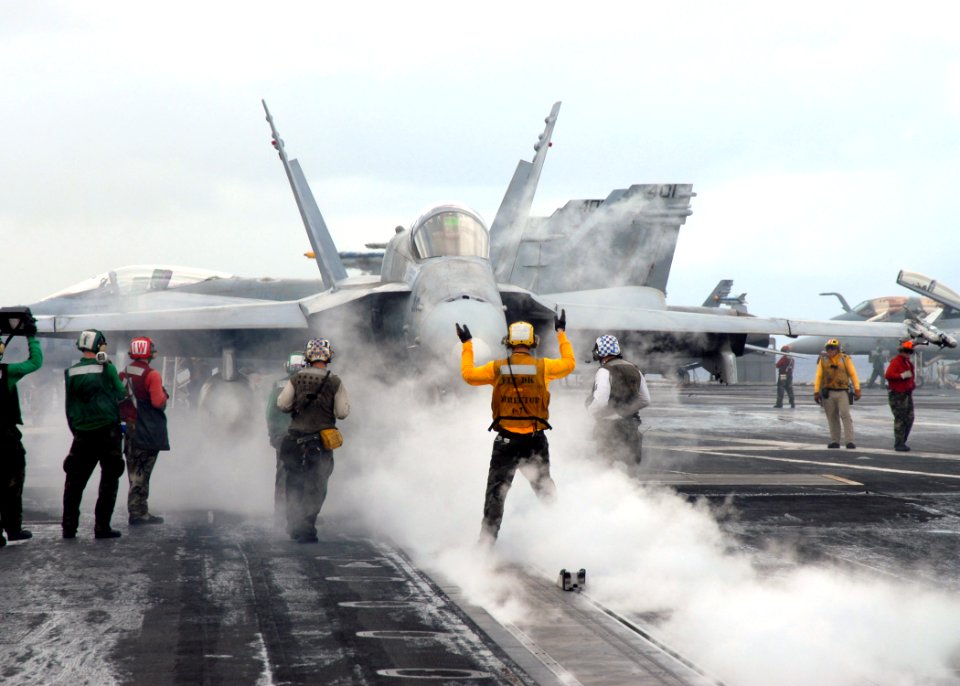 US Navy 081017-N-1644H-080 An F-A-18 Hornet waits to launch from the Nimitz-class aircraft carrier USS George Washington (CVN 73)