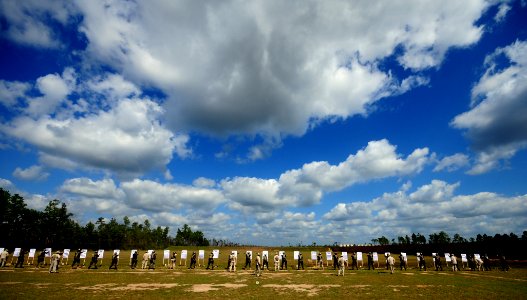 US Navy 081015-N-0411D-010 Sailors practice firing on paper targets from three yards on the first day of live-firing with the 9mm Beretta Pistol. Sailors train in handgun marksmanship