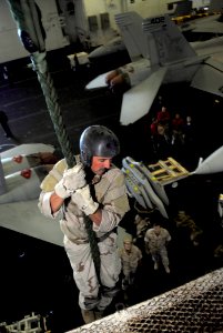 US Navy 081017-N-0684R-059 Senior Chief Explosive Ordnance Disposalman Jon Culver from Plymouth, Calif. and assigned to Explosive Ordnance Disposal Operational Support Unit (EODOSU) 7, conducts fast rope training in hangar bay