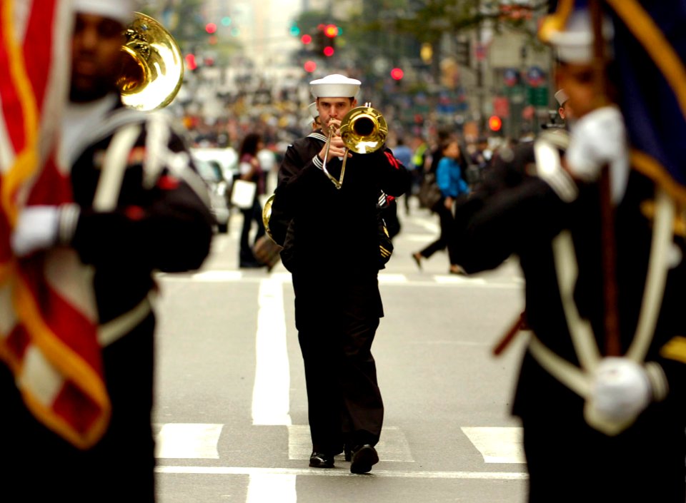 US Navy 081013-N-5758H-591 Musician 2nd Class Carlton Shippee plays the trombone as he marches up 5th Avenue in New York City during the 64th Annual Columbus Day Parade