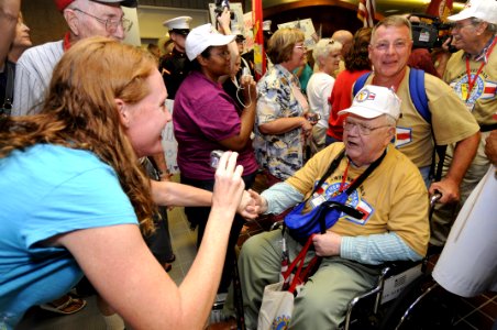 US Navy 081015-N-5328N-383 World War II veteran Everett Crary and his guardian Dr. David Angelette are greeted by dozens of officers and chief petty officers from the Center for Information Dominance Corry Station