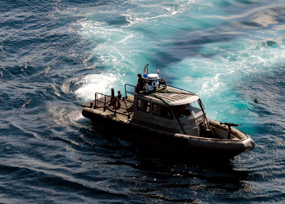 US Navy 100127-N-4971L-191 A security boat patrols the waters surrounding USS Fort McHenry (LSD 43)