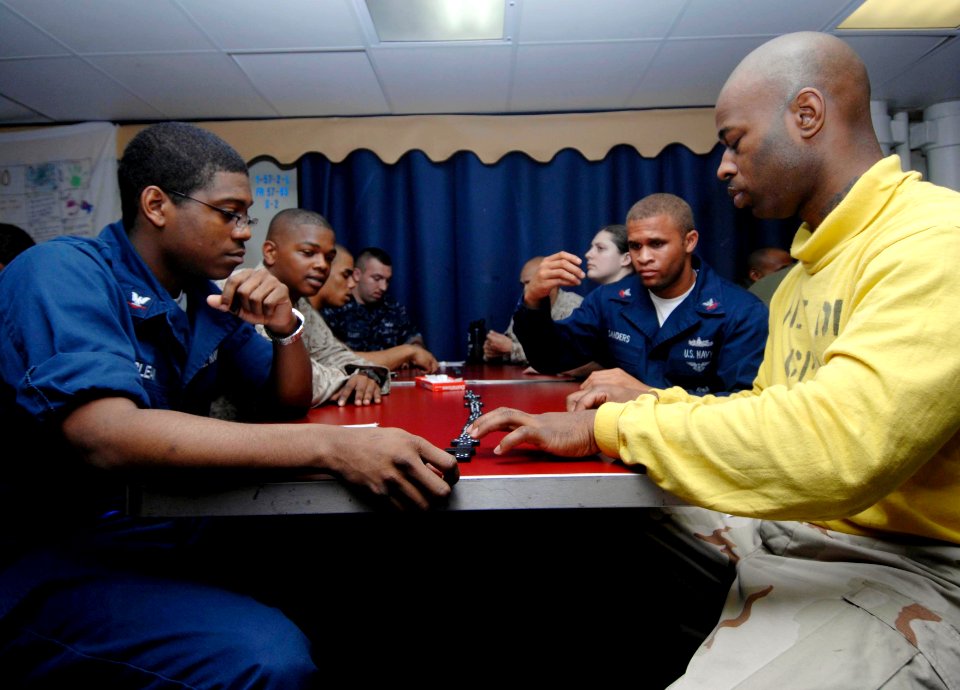 US Navy 100128-N-3592S-035 Sailors compete in a Dominoes tournament aboard the amphibious assault ship USS Nassau (LHD 4)