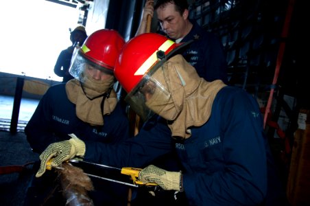 US Navy 100122-N-8936G-014 Sailors participate in a damage control drill