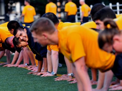 US Navy 081017-N-0807W-088 Sailors assigned to the Whidbey Island-class dock landing ship USS Tortuga (LSD 46) warm-up before participating in the Navy's Fall physical fitness assessment