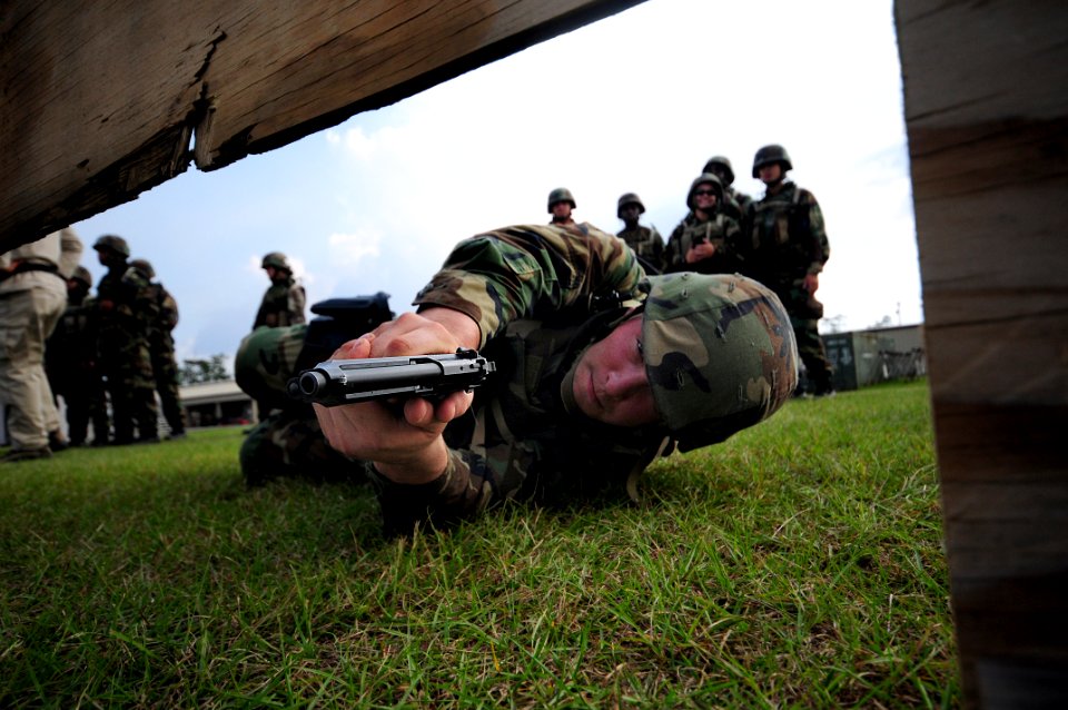 US Navy 081014-N-0411D-029 Builder John Baker dry-fires his Beretta 9mm pistol during tactical handgun marksmanship training at Woolmarket Pistol and Rifle Range during a Navy Expeditionary Combat Skills School training exercis