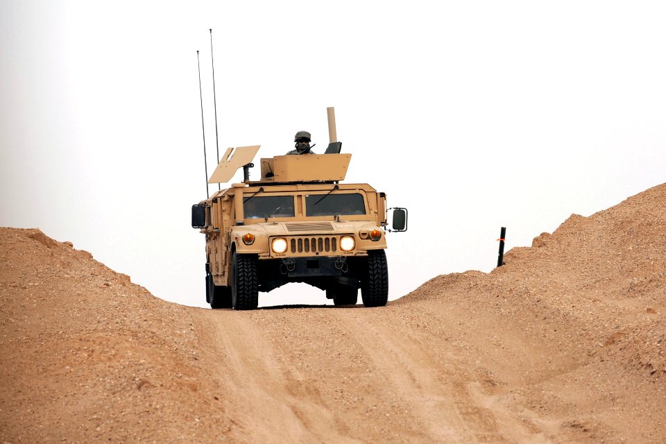US Navy 090227-N-0636S-006 Sailors check the top of a hill during convey training at Udari Range in Kuwait