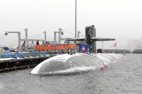 US Navy 090115-N-8467N-001 he fast attack submarine USS Memphis (SSN 691) is moored to the pier at Submarine Base New London in a snowstorm photo