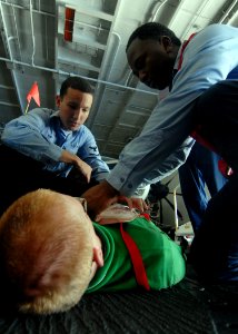 US Navy 081020-N-1038M-014 Aircraft carrier USS George Washington (CVN 73) Sailors participate in a mass casualty drill in the hangar bay